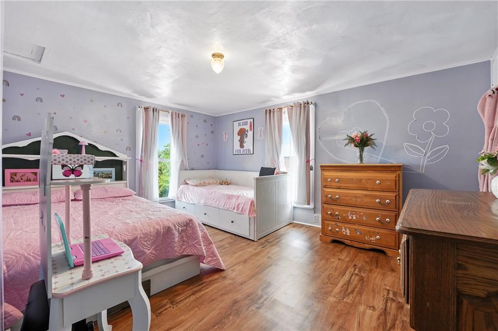 246 Lyons Road Stoneboro, PA 16153 - Photo 16 of 40 a bedroom with furniture and wooden floor