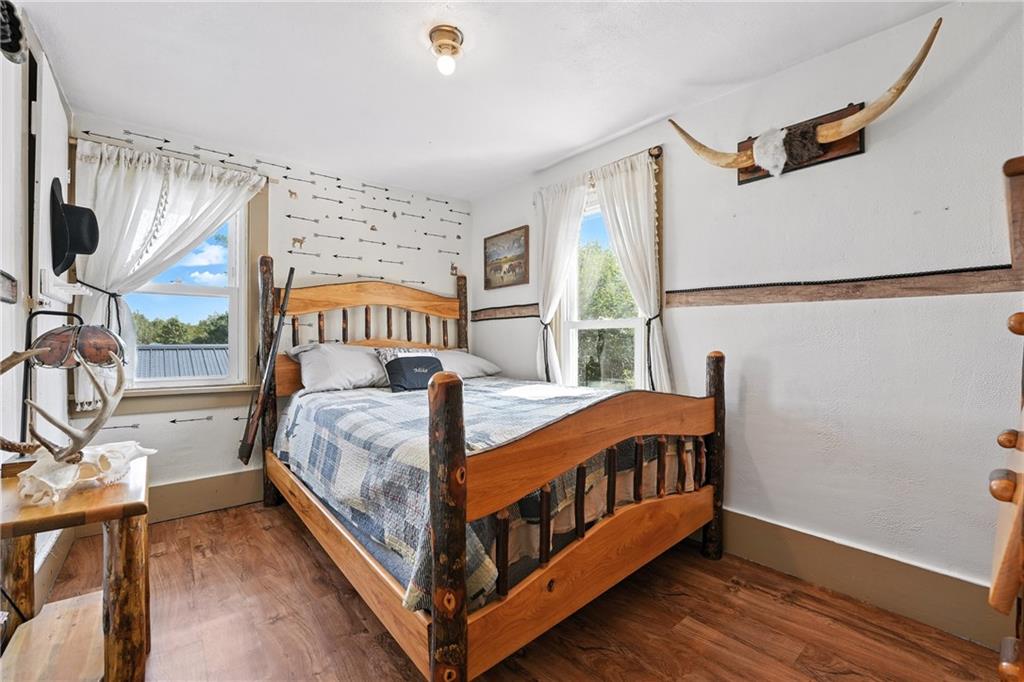 246 Lyons Road Stoneboro, PA 16153 - Photo 17 of 40 a bed sitting in a bedroom next to a window
