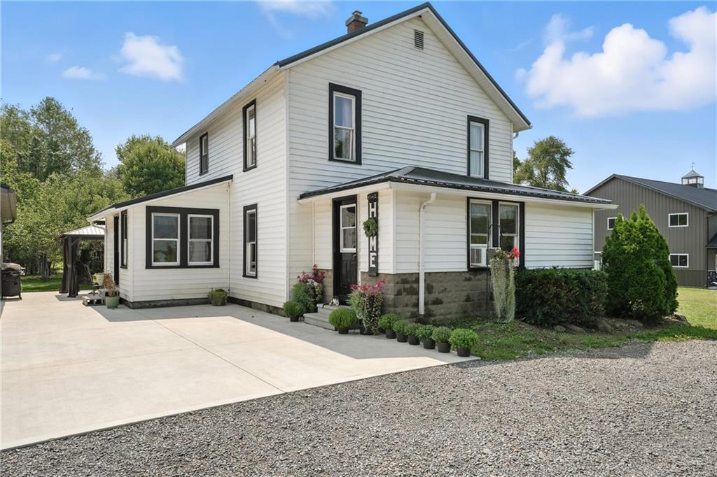 246 Lyons Road Stoneboro, PA 16153 - Photo 2 of 40 a view of a house with a yard and potted plants