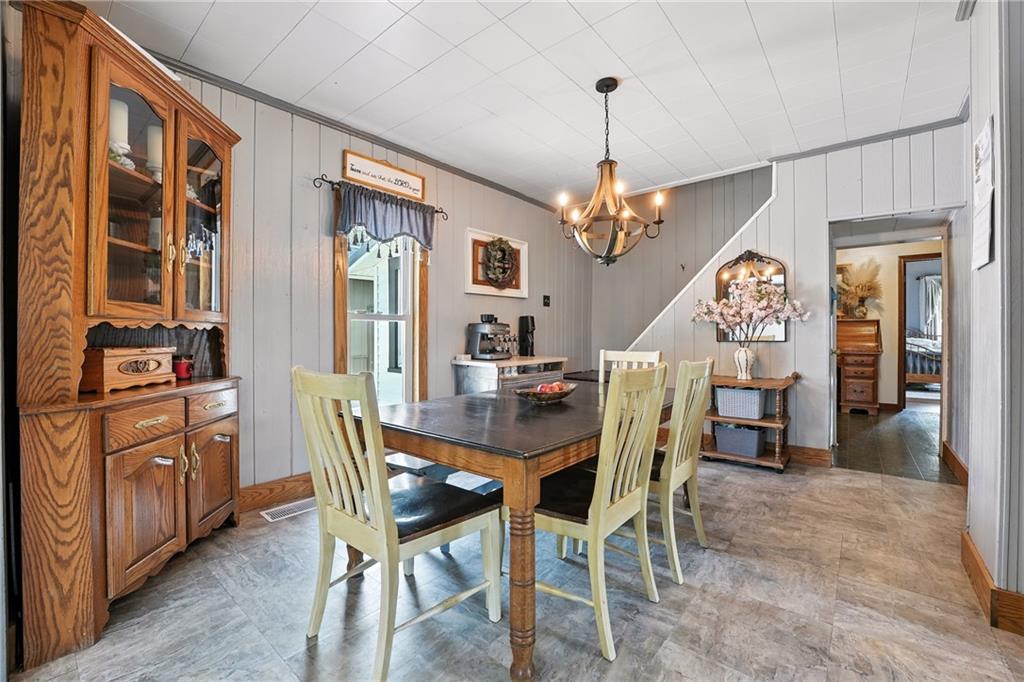 246 Lyons Road Stoneboro, PA 16153 - Photo 9 of 40 a view of a dining room with furniture window and wooden floor