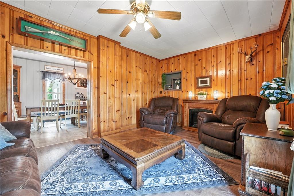 246 Lyons Road Stoneboro, PA 16153 - Photo 10 of 40 a living room with furniture a rug and a chandelier