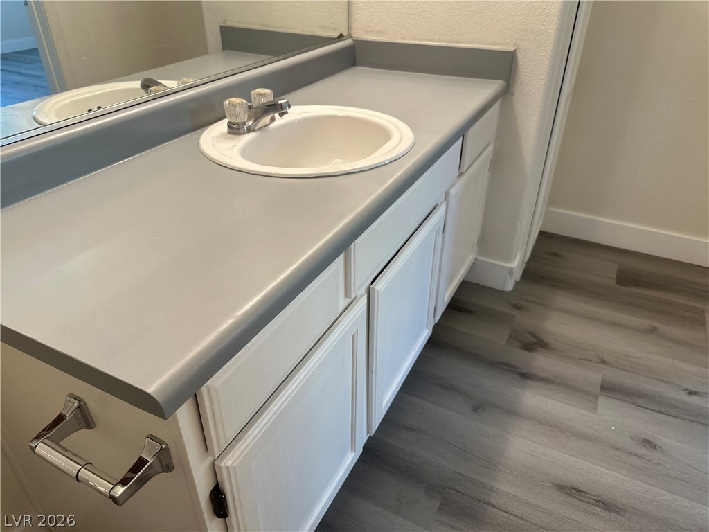7255 West Sunset Road, Unit 2006 Las Vegas, NV 89113 - Photo 18 of 24 A clean, functional bathroom vanity with a spacious countertop and bright cabinetry.