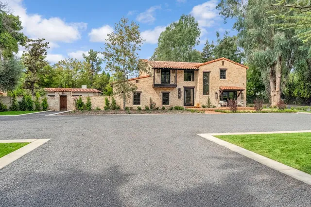 a front view of house with outdoor seating and yard