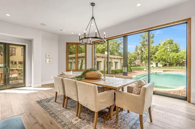 a kitchen with stainless steel appliances kitchen island granite countertop a sink and cabinets