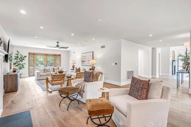 a kitchen with stainless steel appliances granite countertop a sink and a stove