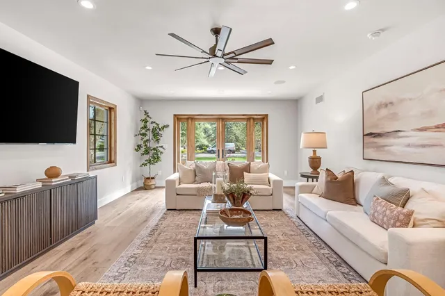 a bathroom with a toilet mirror and vanity