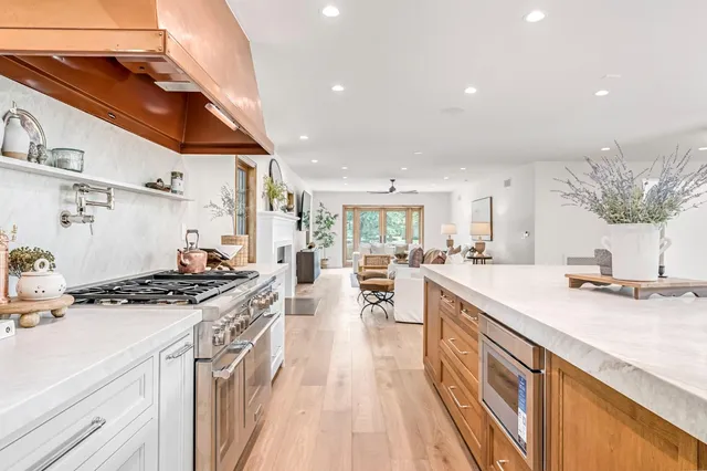 a spacious bedroom with a large bed and a window