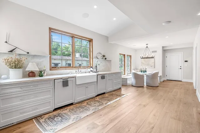 a view of a park with trees and houses