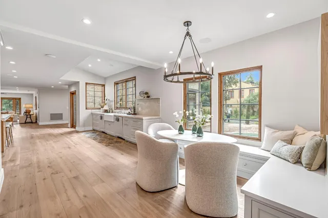 a kitchen with granite countertop a refrigerator and a stove