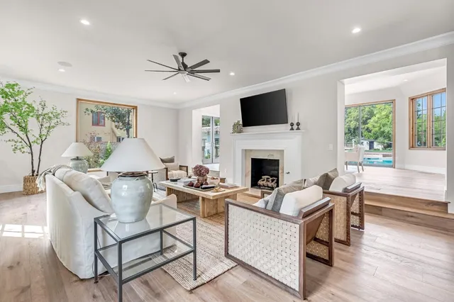 a dining room with furniture window and wooden floor