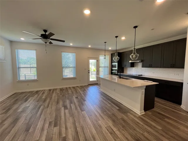 a view of a house with a garden and deck