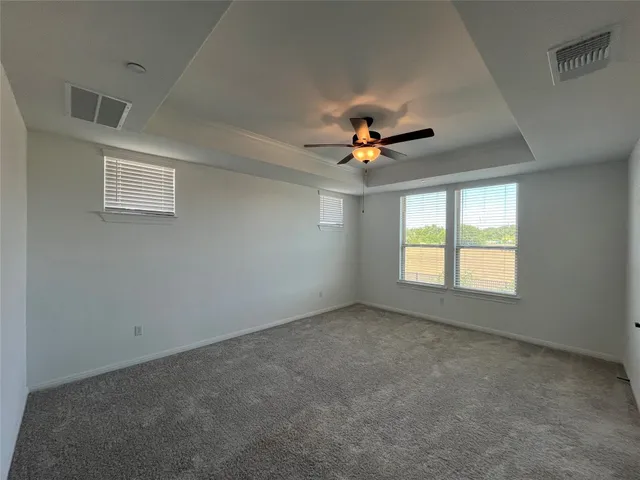 a kitchen with kitchen island a sink appliances and a counter top space