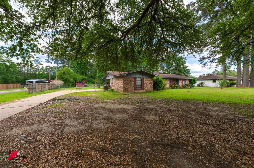 Brick exterior home with a partial front porch