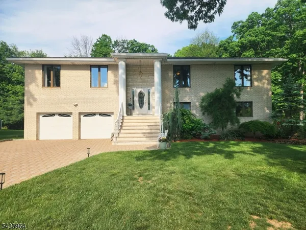 a front view of a house with garage