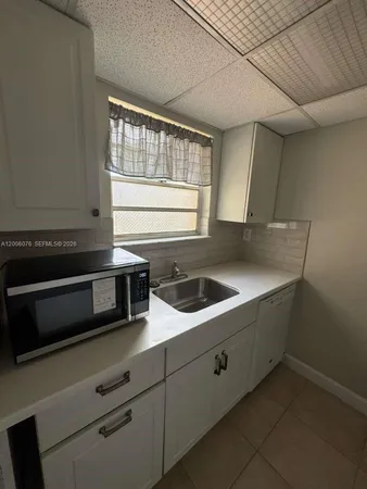 a view of an empty room with a stove