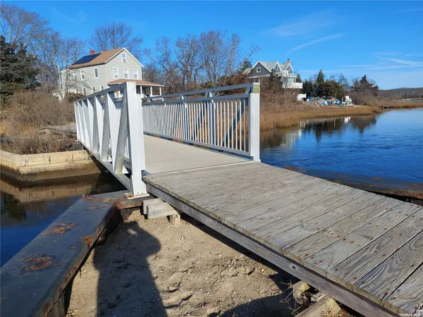 a view of a backyard with sitting area