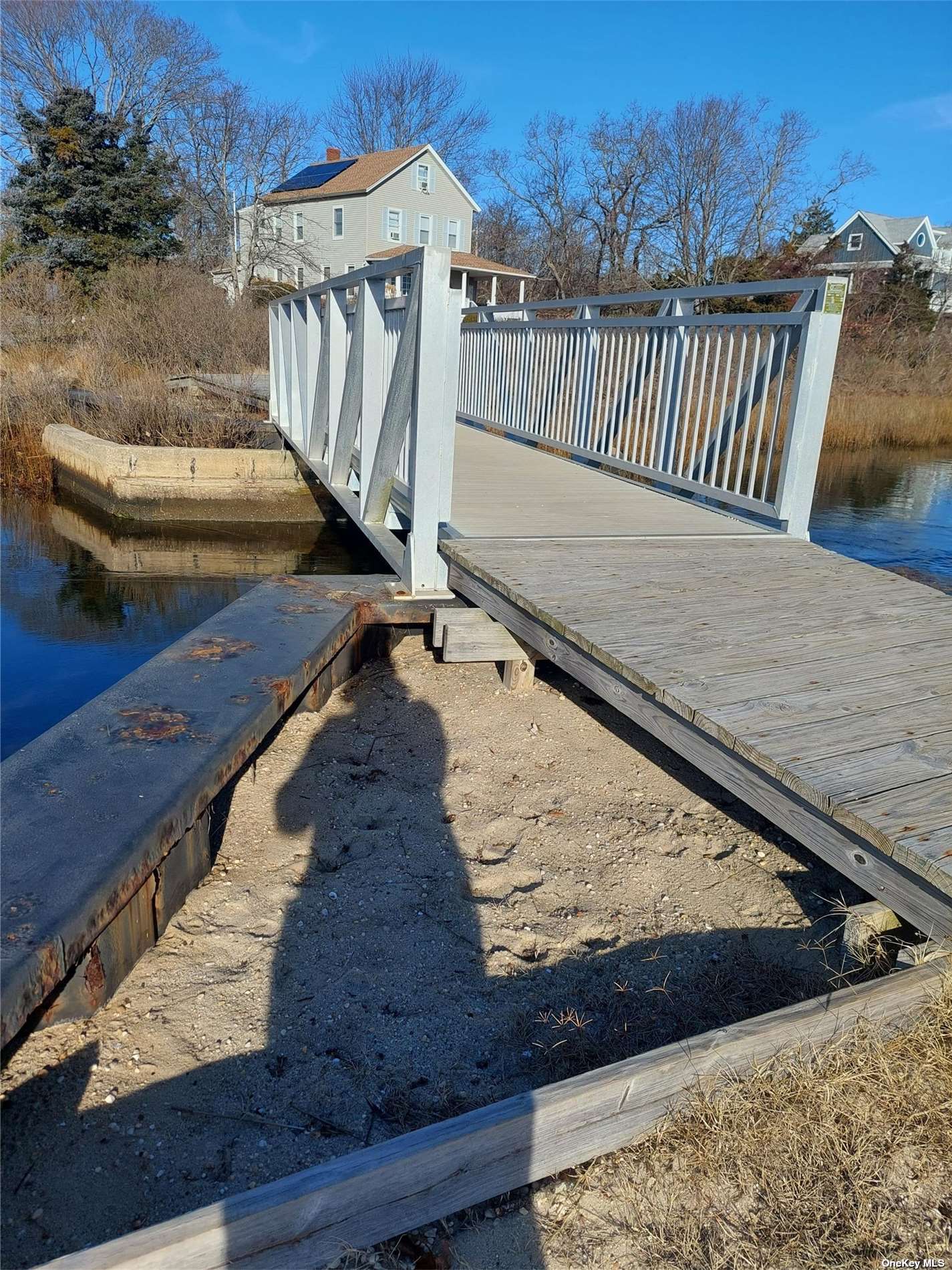 150 Pipes Neck Road Greenport, NY 11944 - Photo 3 of 5 a view of a roof deck with wooden floor and fence