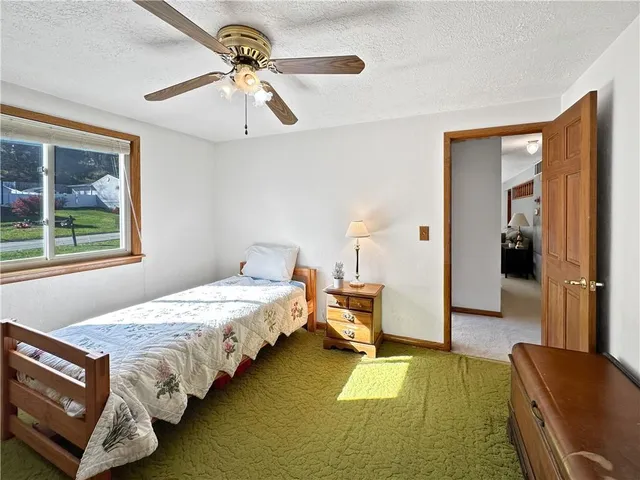 a bedroom with bed and window