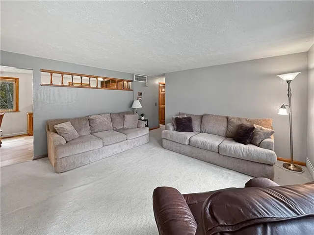 a living room with furniture and a couch