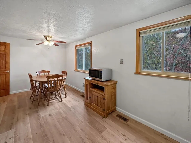 a dining room with furniture and window