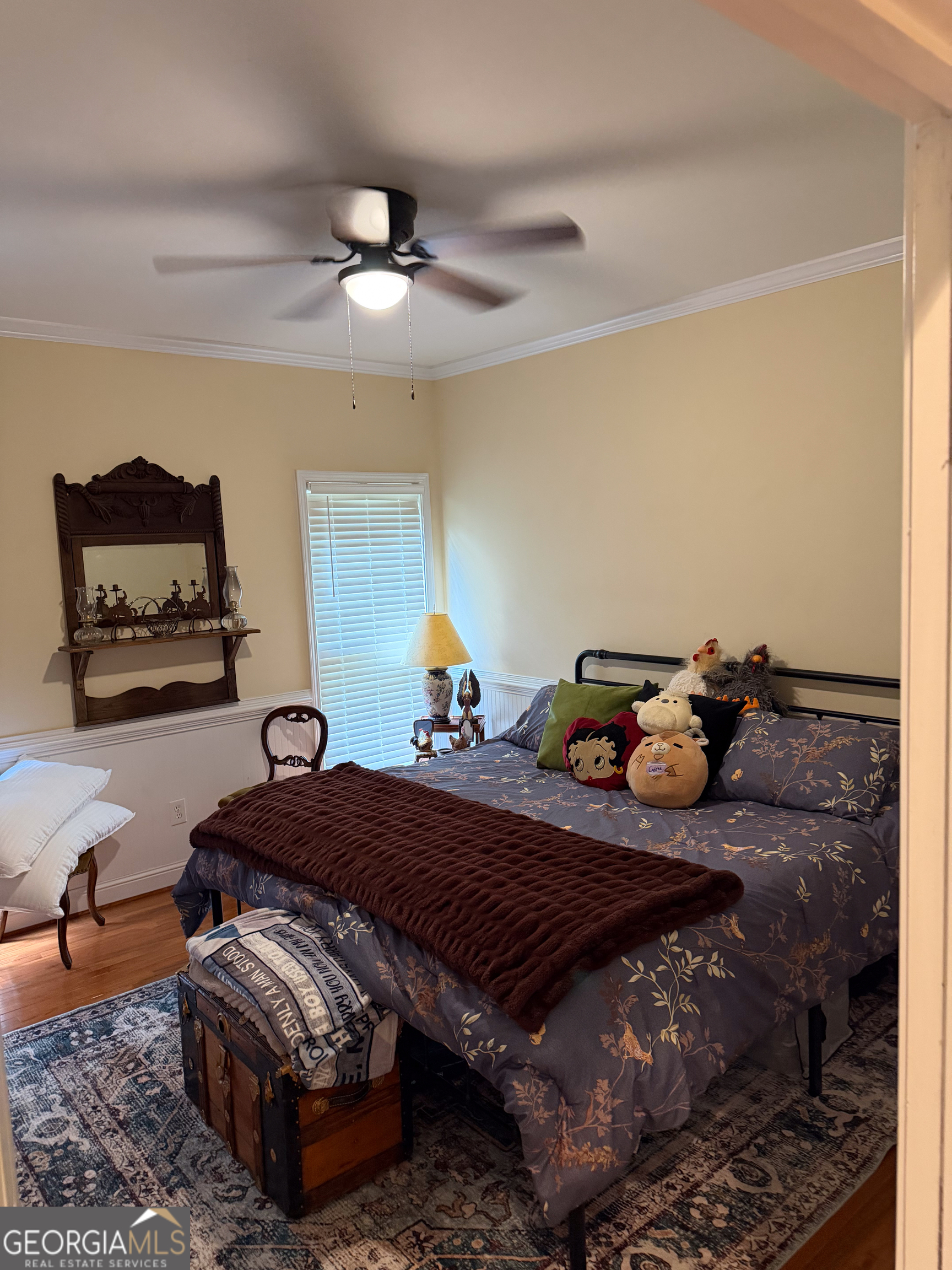 3385 Highway 83 Monticello, GA 31064 - Photo 34 of 47 a bed room with furniture and a chandelier