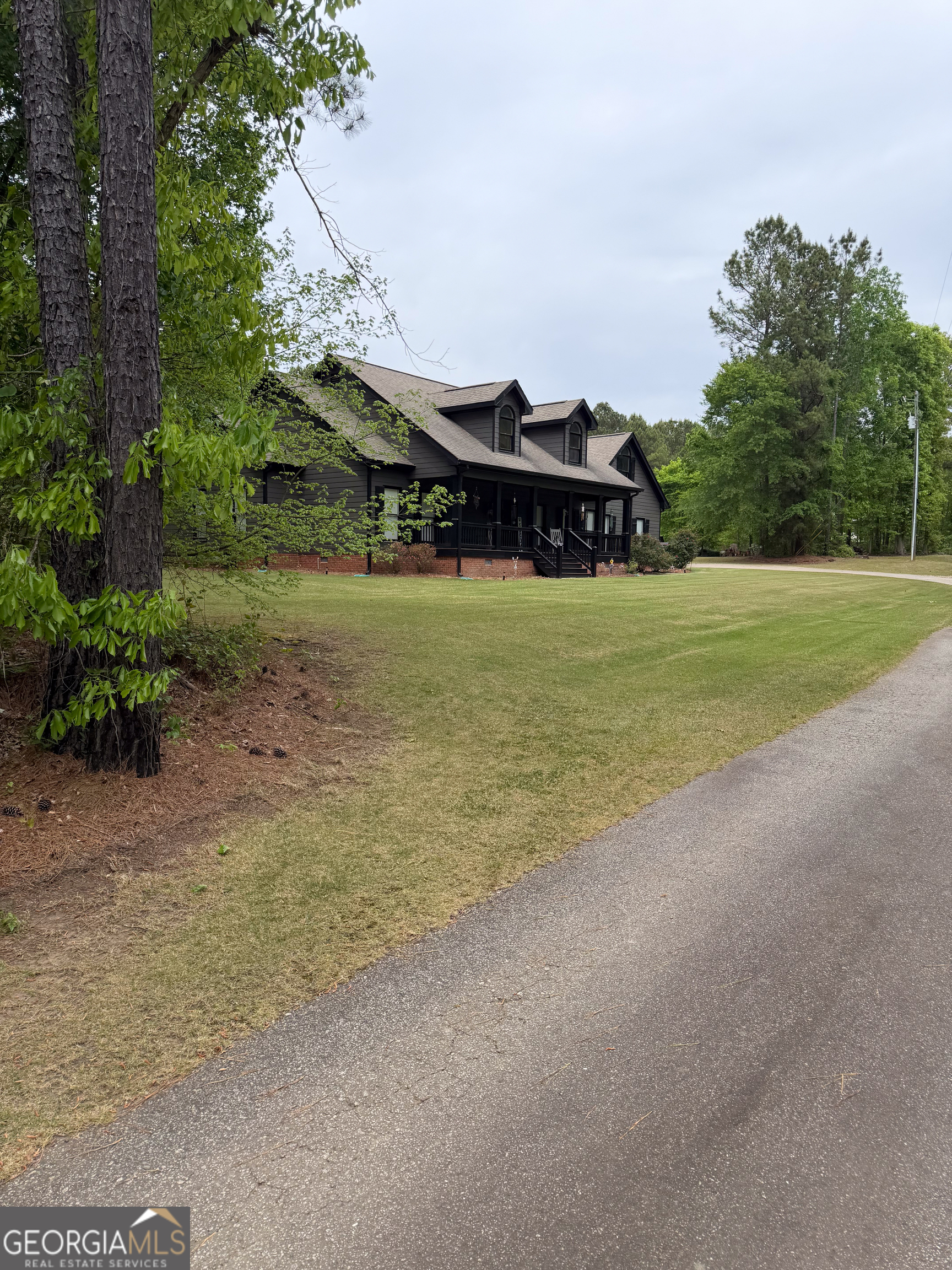 3385 Highway 83 Monticello, GA 31064 - Photo 5 of 47 a view of a house with a yard and potted plants