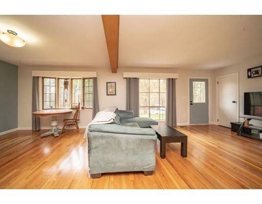11 Enfield Road Pelham, MA 01002 - Photo 12 of 28 a living room with furniture and a wooden floor