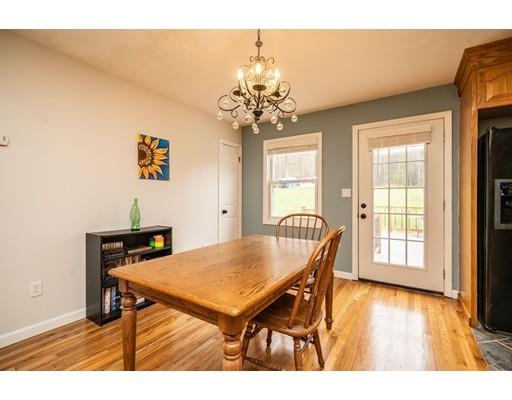 11 Enfield Road Pelham, MA 01002 - Photo 15 of 28 a view of a dining room with furniture and wooden floor