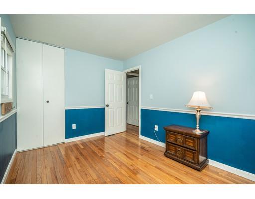 11 Enfield Road Pelham, MA 01002 - Photo 19 of 28 a bedroom with a bed and a lamp on table