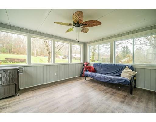 11 Enfield Road Pelham, MA 01002 - Photo 23 of 28 a living room with furniture and a large window