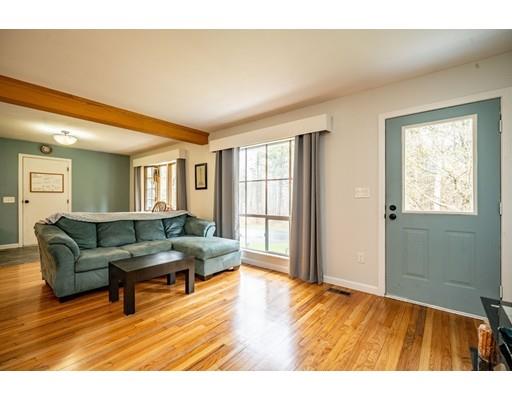 11 Enfield Road Pelham, MA 01002 - Photo 10 of 28 a living room with furniture and a large window