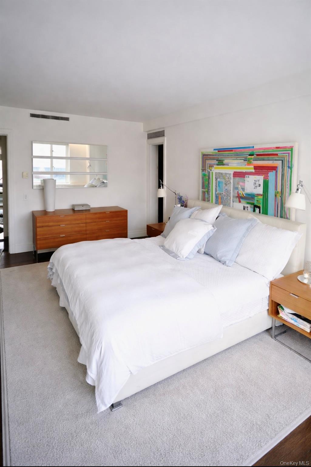 200 East 66th Street, Unit B1503 Manhattan, NY 10065 - Photo 11 of 24 a bedroom with bed and window