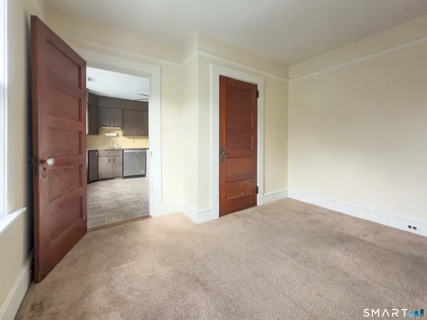 a view of an empty room with a window