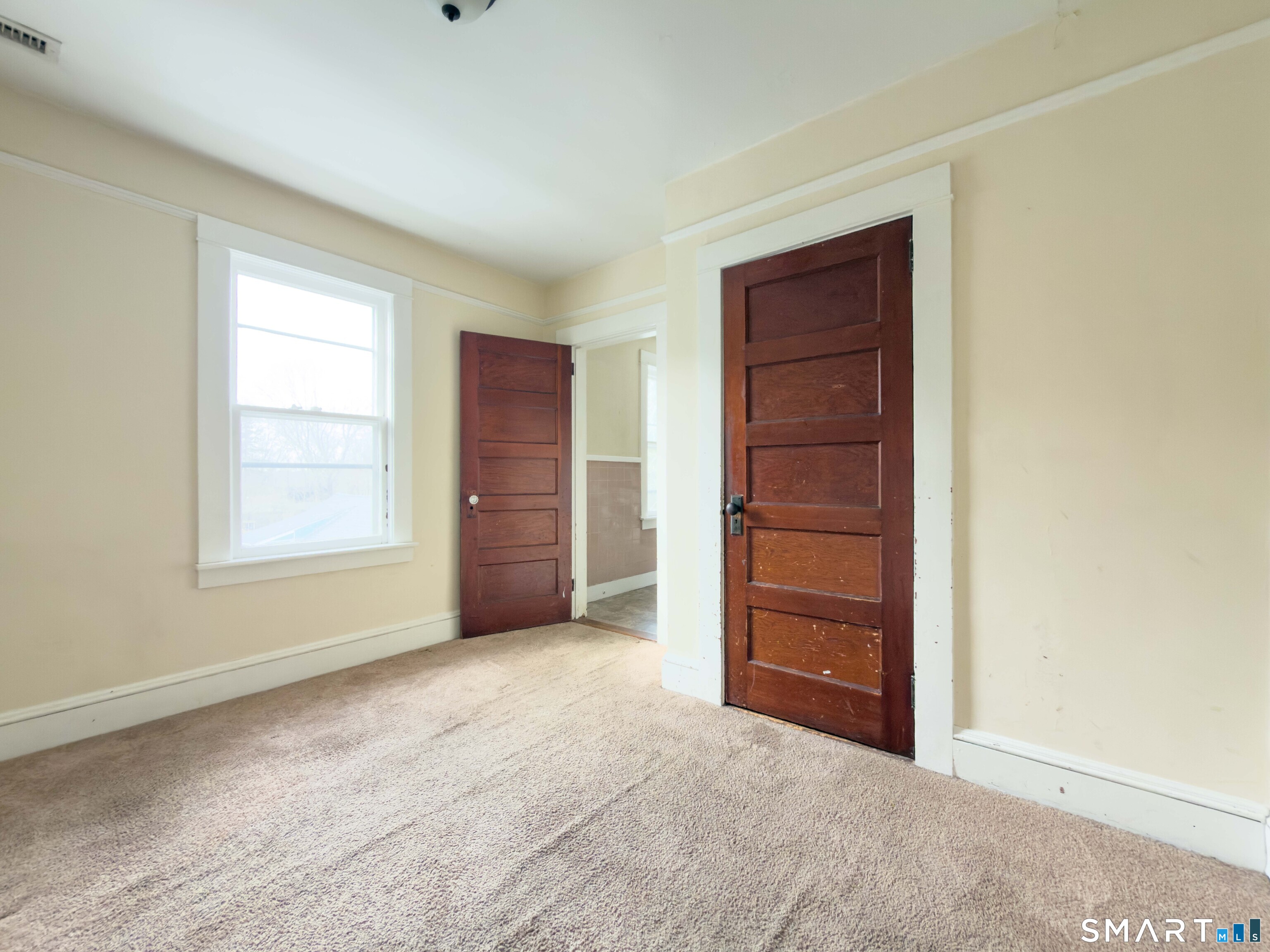 72 Roosevelt Avenue Norwich, CT 06360 - Photo 17 of 21 a view of an empty room with a window