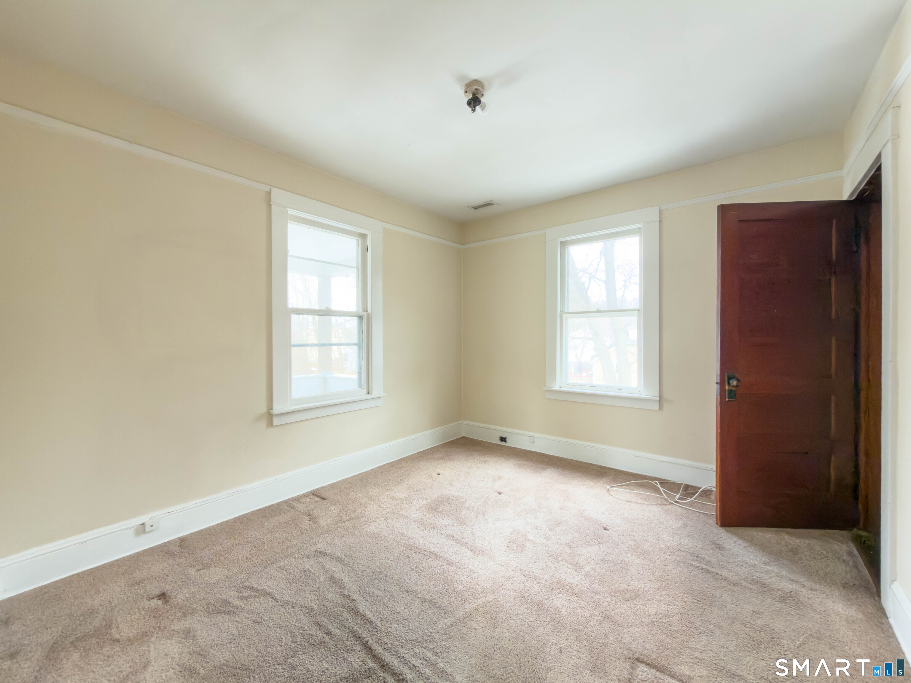 72 Roosevelt Avenue Norwich, CT 06360 - Photo 18 of 21 an empty room with windows