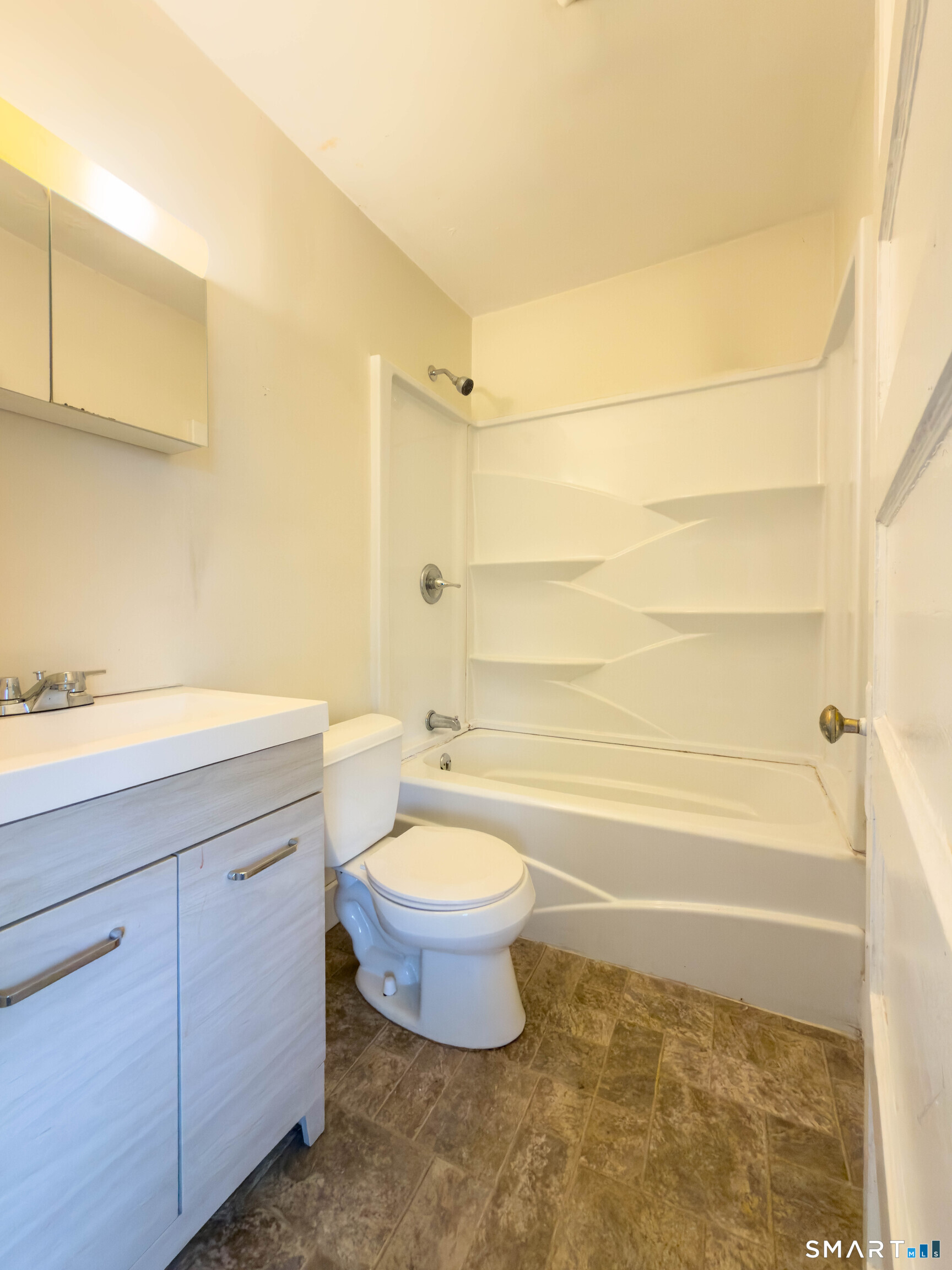 72 Roosevelt Avenue Norwich, CT 06360 - Photo 21 of 21 a bathroom with a sink a toilet and bathtub