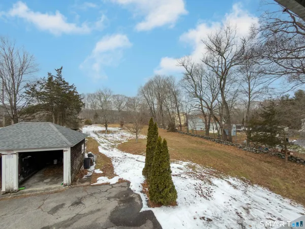 a view of a yard covered with snow in the yard