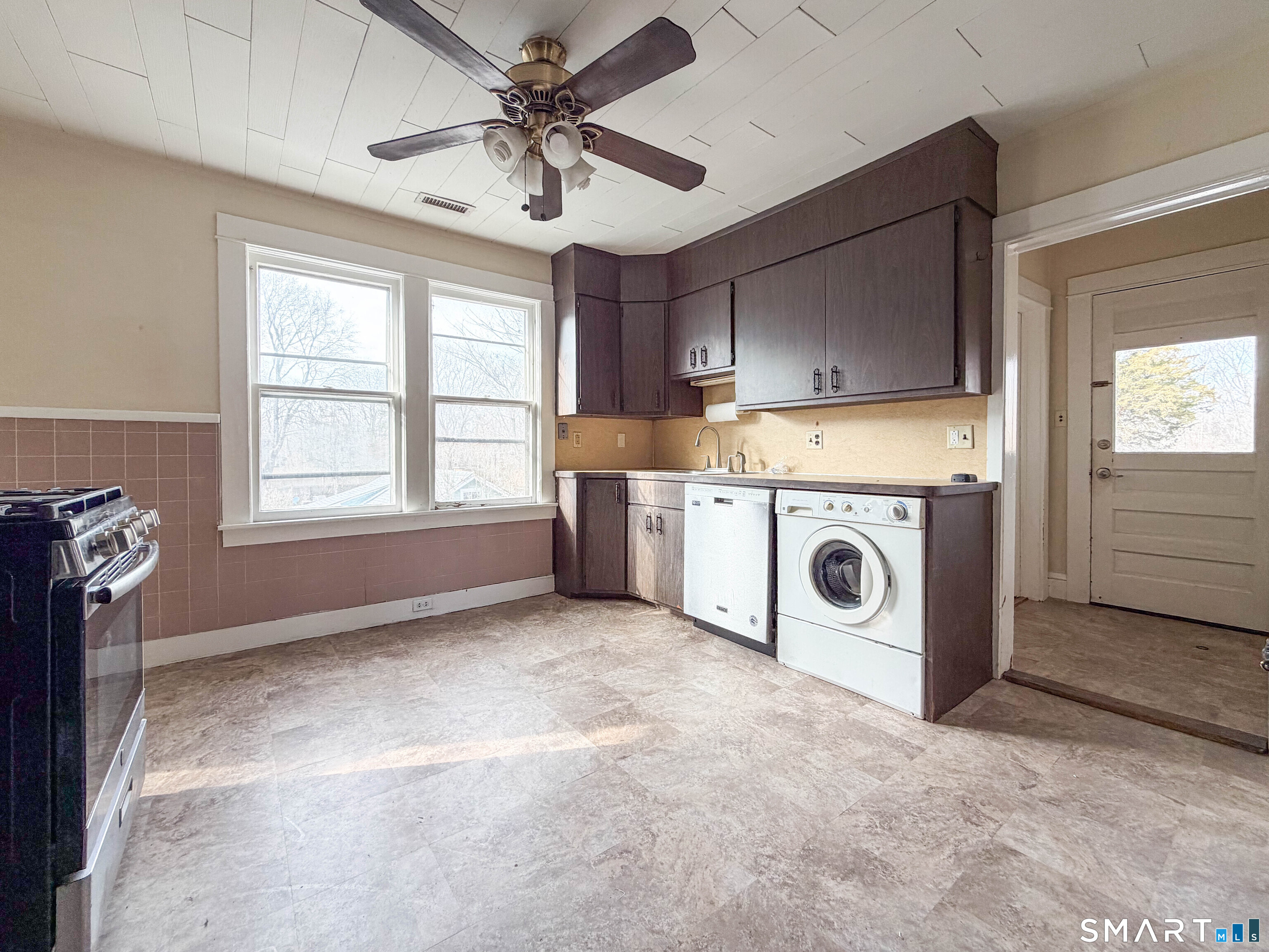 72 Roosevelt Avenue Norwich, CT 06360 - Photo 5 of 21 a view of a kitchen with a stove cabinets and a ceiling fan