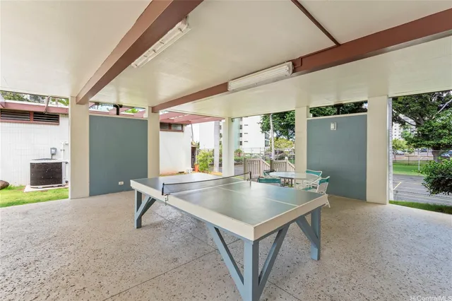 a view of livingroom with furniture and a kitchen