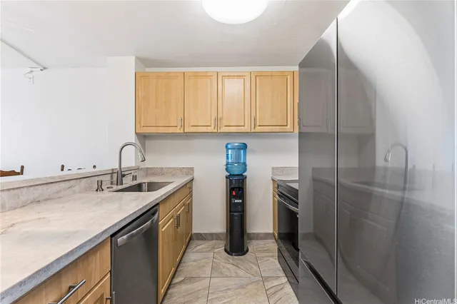 a kitchen with a sink and cabinets
