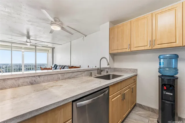 a kitchen with stainless steel appliances granite countertop a sink and cabinets