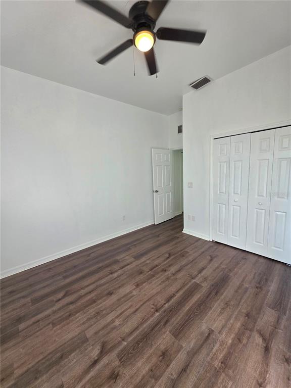 2818 Northeast 24th Place Ocala, FL 34470 - Photo 16 of 20 a view of an empty room with wooden floor