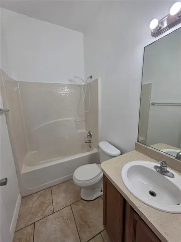 a bathroom with a sink a toilet and a bathtub