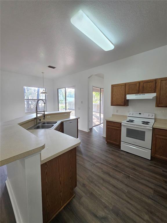 2818 Northeast 24th Place Ocala, FL 34470 - Photo 8 of 20 a kitchen with stainless steel appliances a stove top oven
