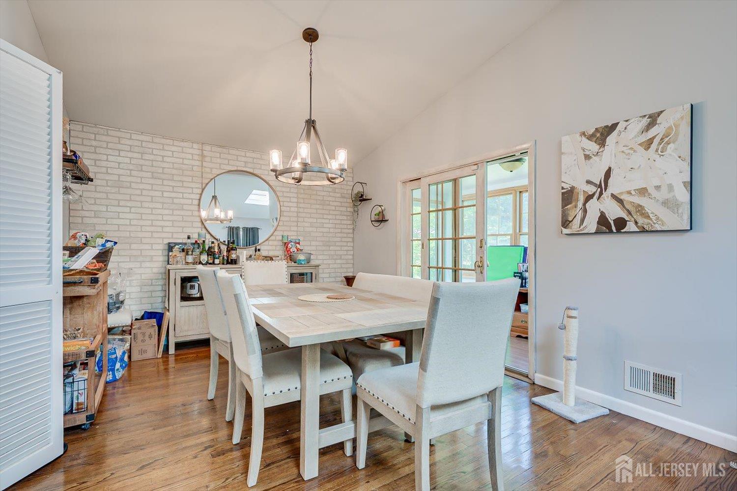 12 Gales Road Edison, NJ 08837 - Photo 8 of 35 a view of a dining room with furniture wooden floor and chandelier
