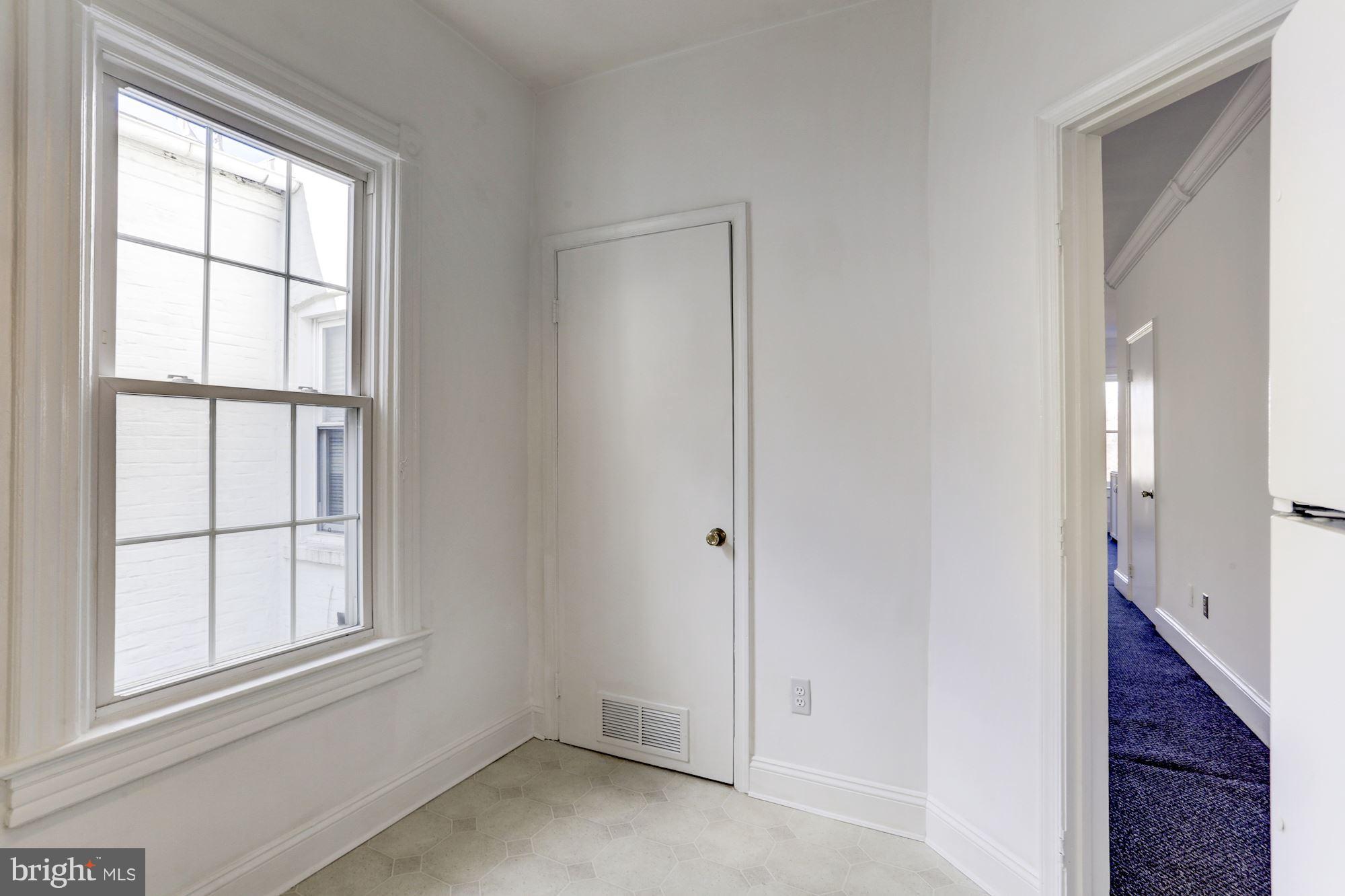 3022 R Street Northwest, Unit 3 Washington, DC 20007 - Photo 13 of 24 Kitchen with window and room for a breakfast area.