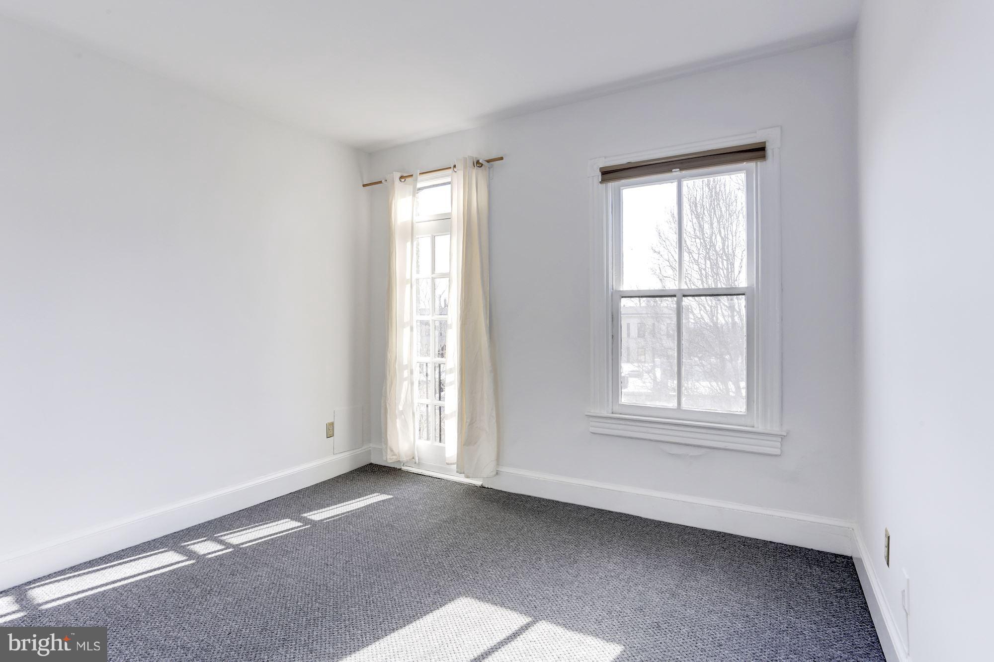 3022 R Street Northwest, Unit 3 Washington, DC 20007 - Photo 14 of 24 Master Bedroom - with views of nearby rooftops.