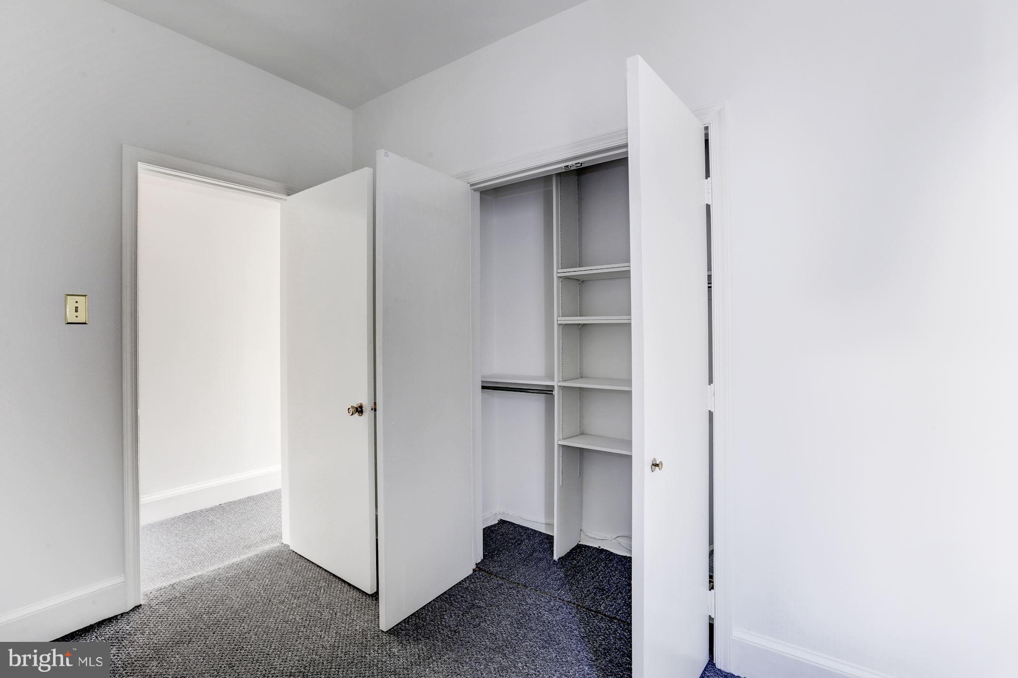 3022 R Street Northwest, Unit 3 Washington, DC 20007 - Photo 20 of 24 Guest bedroom closet with built ins.
