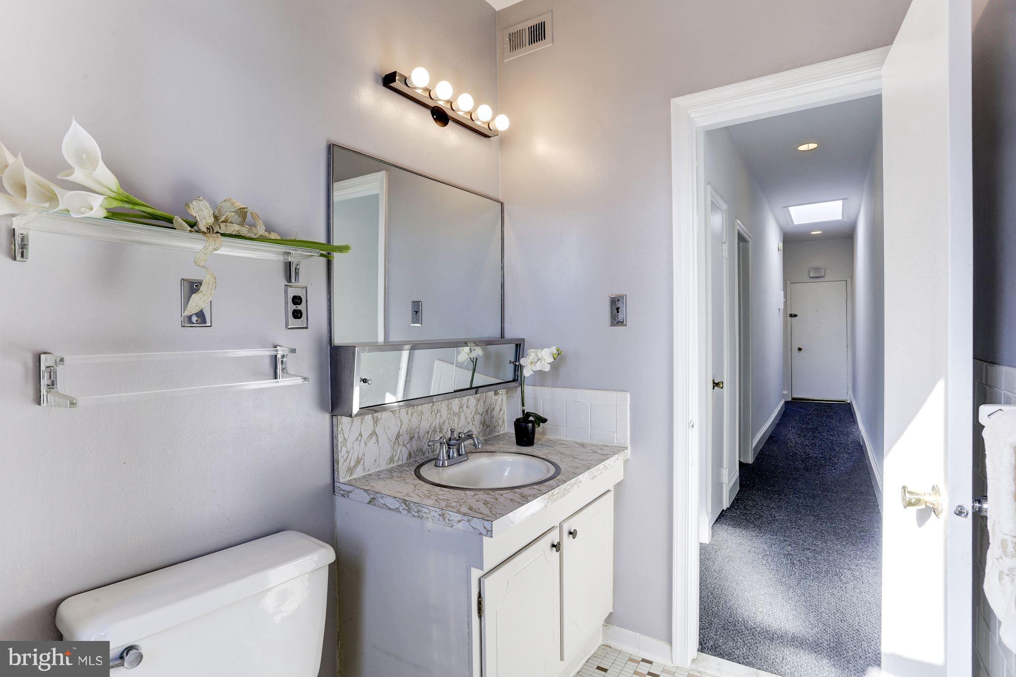 3022 R Street Northwest, Unit 3 Washington, DC 20007 - Photo 21 of 24 Bathroom off hallway.