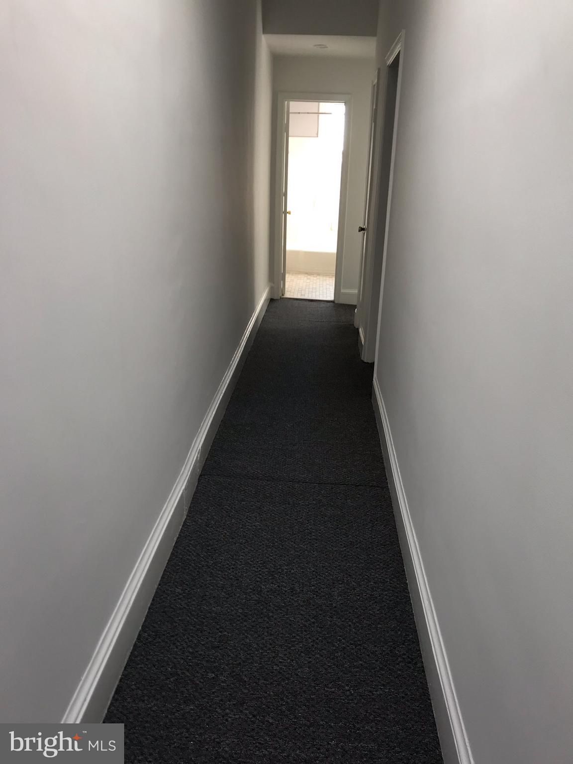 3022 R Street Northwest, Unit 3 Washington, DC 20007 - Photo 9 of 24 View of Hallway from front to back.